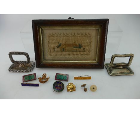 A collection of items to include sampler in rosewood frame, various military and enamel badges etc