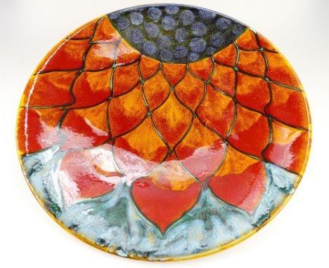 Large Poole Studio ware charger signed M. Massarella to rear, decorated in abstract design with red, orange and blue colours,