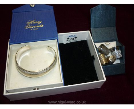A Silver Bangle and two Silver Thimbles and another