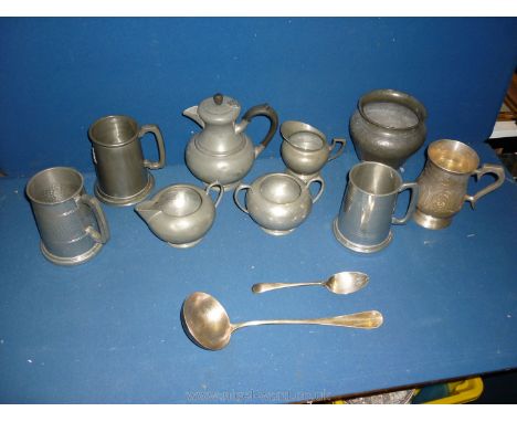 A box of pewter items to include jugs, tankards, coffee pot, large white metal ladle and spoon.