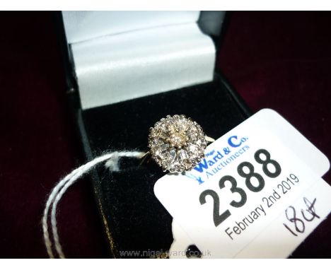 An 18ct diamond cluster Ring.