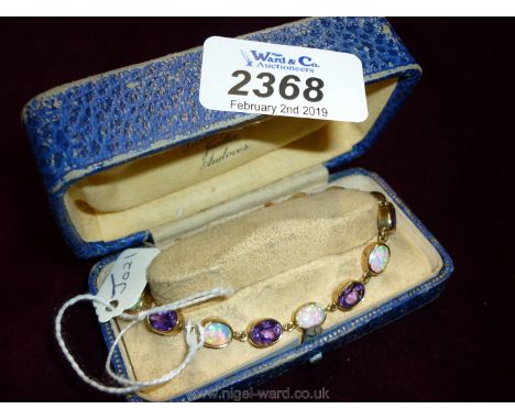 A 9ct gold, 14ct opal and 14ct amethyst Bracelet.