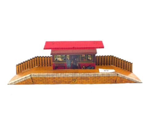 A Brimtoy tin plate station platform