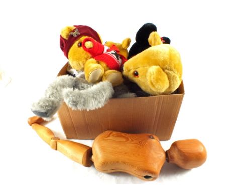 A wooden articulated model and various bears