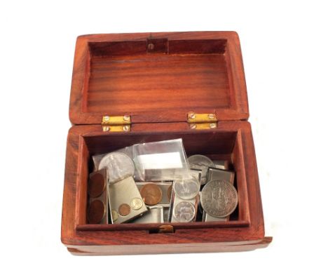 A puzzle box containing a US 1945 dollar and other 1945 coins, mostly attached to tie clips