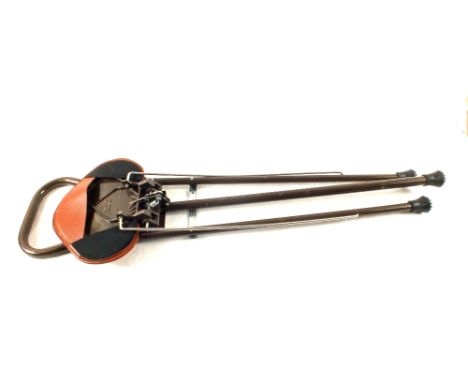 A modern shooting stick/chair