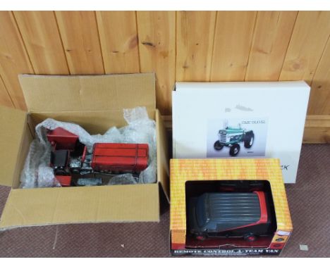 A boxed remote control A-Team van, a tin plate tractor and a battery tractor clock