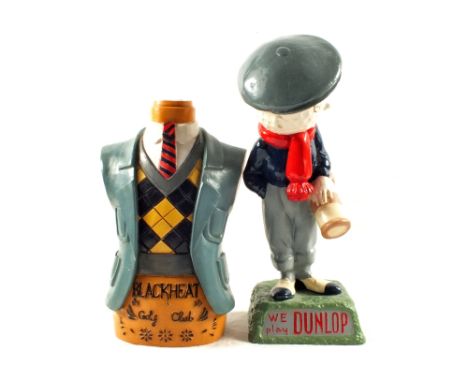 A Dunlop plaster golfing caddy mascot (copy of earlier golf club papier mache model) and a black heat torso