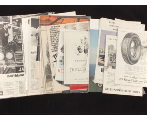 A box of vintage car adverts