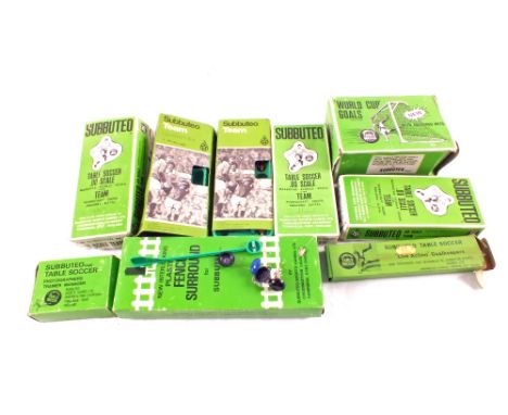 Five boxed Subbuteo teams (not all complete), a goal net, a goalkeepers set, fence surrounds and photographers trainer manage
