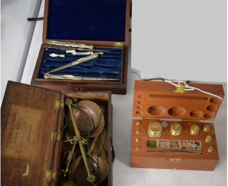 A set of copper and brass scales, by William Williams, Scale Maker London, in box; together with a set of brass watchmaker's 