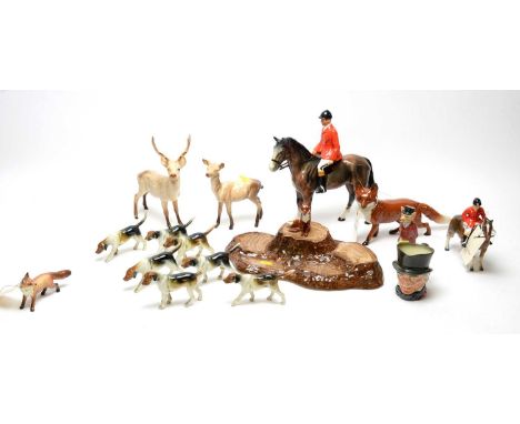 A collection of Beswick and other ceramic hunting figures, including: Beswick stag and doe figures; two Beswick fox figures; 