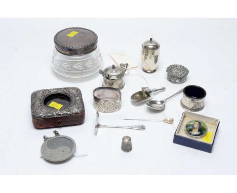 A selection of silver items, including: condiments, napkin ring, pill pot and other items. 