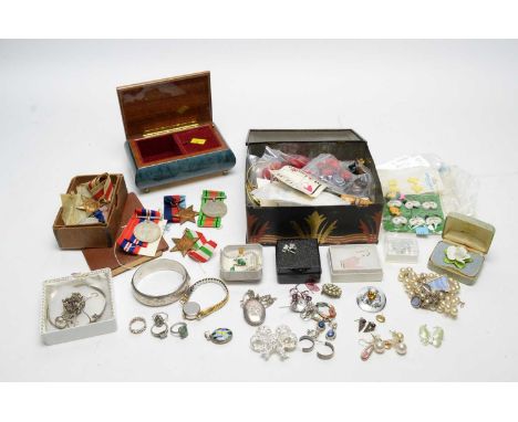 An assortment of costume jewellery including rings, a silver bangle, buttons, pendant; together with a selection of Second Wo