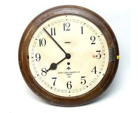 A Smiths Clocks &amp; Watches Ltd London mahogany cased wall timepiece, the cream dial with Arabic numerals in black, black m