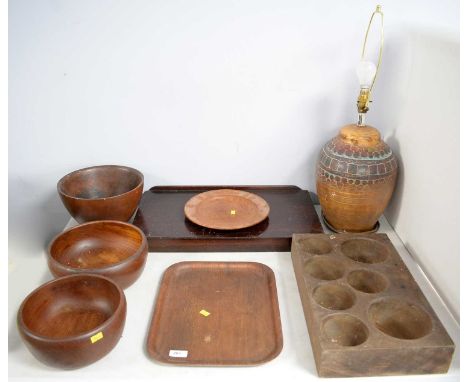 A set of three Galatrix handmade Burma teak circular bowls, of sizes, each with impressed mark to underside; together with a 