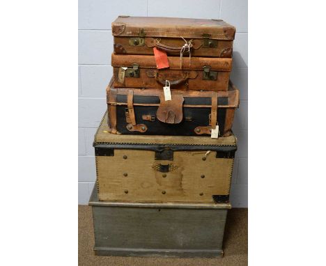 A vintage stained pine blanket box, 83 x 43 x 44cms; a vintage canvas-covered and brass studded travelling trunk, with initia