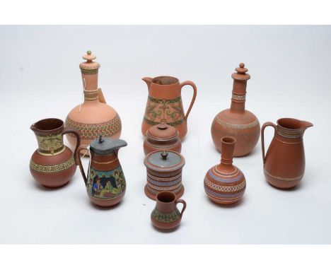 A selection of Dudson patent mosaic red earthenware, comprising: two guglets and covers; a jug; a small vase; and lidded toba