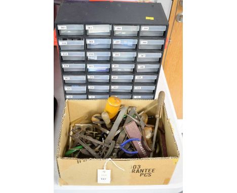 A selection of watch making tools, parts and batteries, including callipers, files, buckles, buckle parts, and other items. 