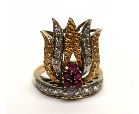 A ruby and diamond ring of flame design, in white and yellow gold mount, tests as 18ct gold, ring size K, 7.4g gross. 