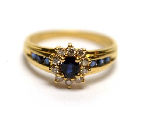 A sapphire and diamond ring, on 18ct yellow gold mount and shank, ring size K, 2.6g gross. 