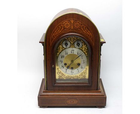 A German inlaid walnut bracket clock, circa 1900, the ornate dial with silvered Arabic dial and chime/silent and slow/fast di