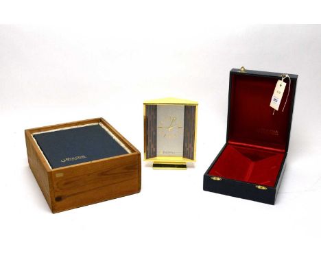 A Bulova Accutron mantel clock, the white dial with gilt metal hands and baton hour markers, in gilt case, 18cms high, in fit