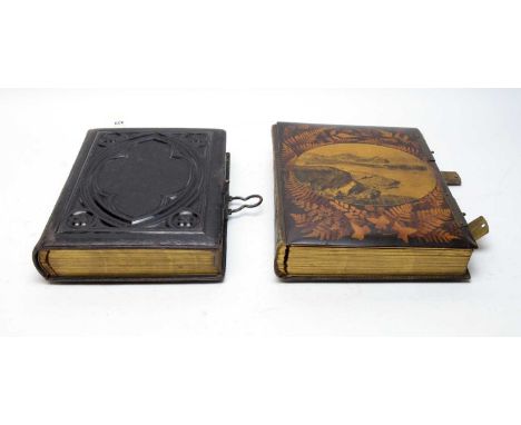 Two Victorian photograph albums, containing a collection of family and portrait photographs. 