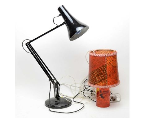 A modern Anglepoise desk lamp, in black; together with a contemporary orange desk lamp with shade. (2) 