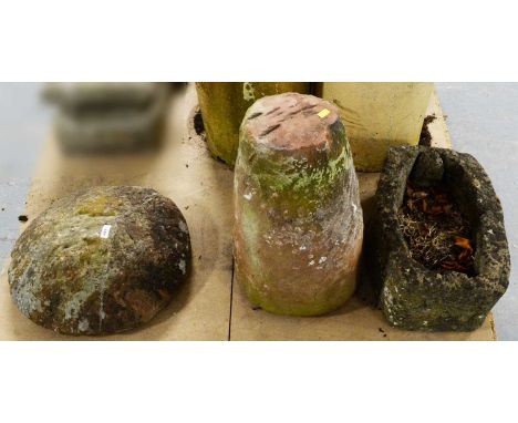 A stone composite garden mushroom ornament, with pillar base and domed top; together with a naturalistic stone composite gard