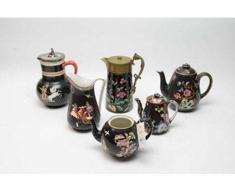 A Ridgway enamelled Jetware claret jug, of tapering cylindrical form, floral and butterfly decoration, cast metal mounts and 