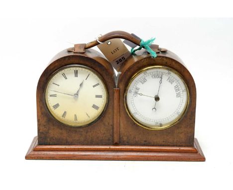 A 20th century walnut cased twin dial time and weather gauge, with clock and barometer,  with carved stylised handle decorati