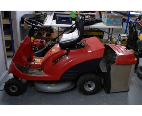 A Honda HF 1211 Hydrostatic ride-on lawnmower, in red, with operator's manual. 