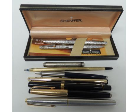 A Sheaffer fountain pen and ball point pen set, in textured white metal cases and in original box with leaflet, together with