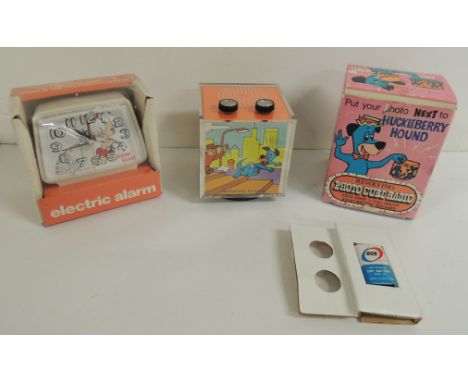 A Solid State revolving photo cube radio Huckleberry Hound in original box with original battery together with an Ingraham Ba