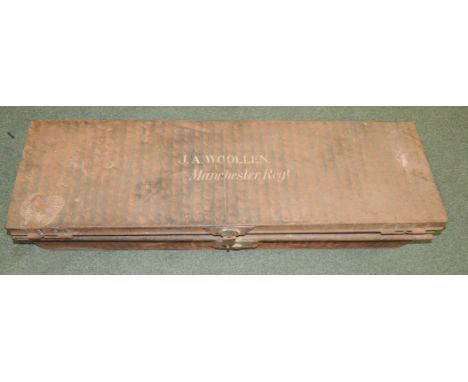 A rectangular painted metal trunk the lid painted in white "J A Woollen Manchester Regt" with original brass lock 105.5cms lo