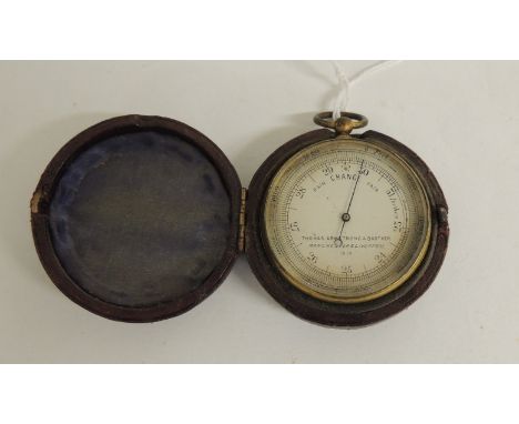 A pocket barometer by Thomas Armstrong & Brother, Manchester & Liverpool in gilt brass case with silvered metal dial and in o