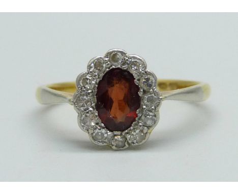 An 18ct gold, diamond and red stone ring, 2.4g, N 