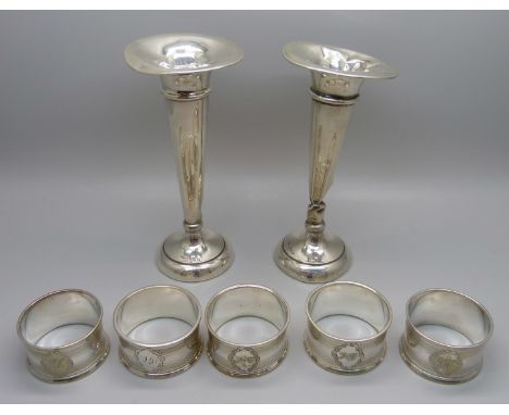 A pair of silver vases, a/f, and five plated napkin rings 