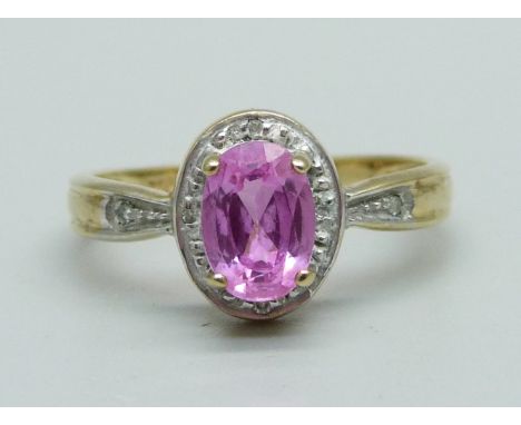 A 9ct gold ring set with a pink stone and diamonds, 2.2g, N 