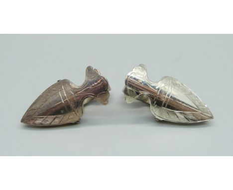 A pair of silver dress clips 