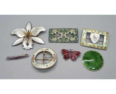 Five silver and enamel brooches including a large  Norwegian flower brooch, a green circular plaque lacking pin and hook and 