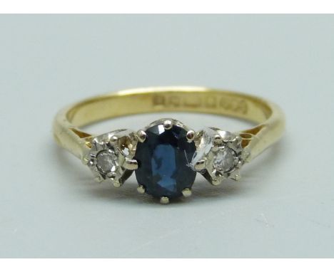 An 18ct gold, sapphire and diamond three stone ring, 2.7g, L 