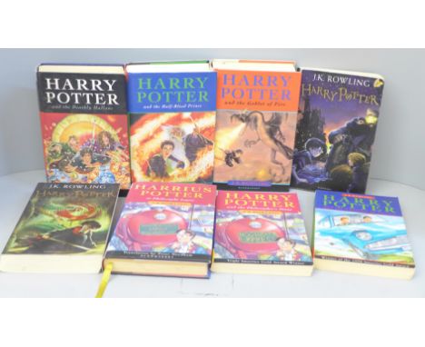 Eight Harry Potter novels; two First Editions 