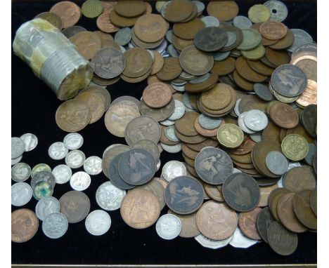 A collection of assorted UK coins, including thirteen silver 3d and a roll of commemorative crowns 