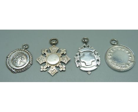 Four silver fob medals, including one football medal with inscription, 'Belfast Garrison League, 1934-35, J. McDonnell', 47g 