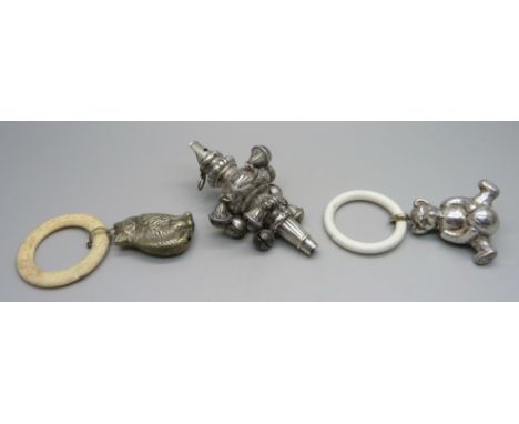 A Victorian silver rattle/whistle, Birmingham 1896, a Teddy bear rattle and a cat rattle 