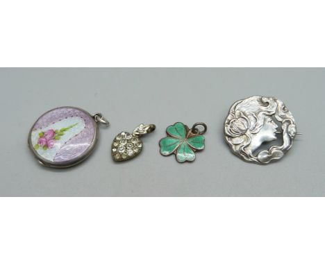 A 935 silver and enamelled locket, an Art Nouveau  silver brooch, made from a button, a hallmarked silver heart charm and a s