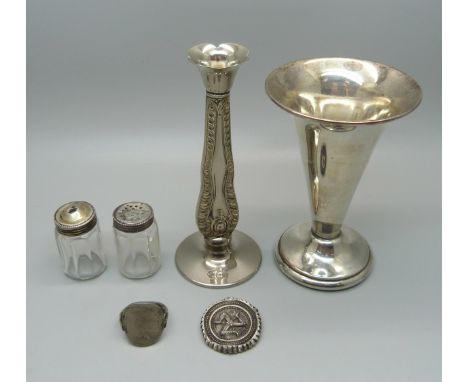 A small silver topped salt and pepper pair, a/f, an Isle of Man brooch lacking pin, a ring made from a US coin and two plated