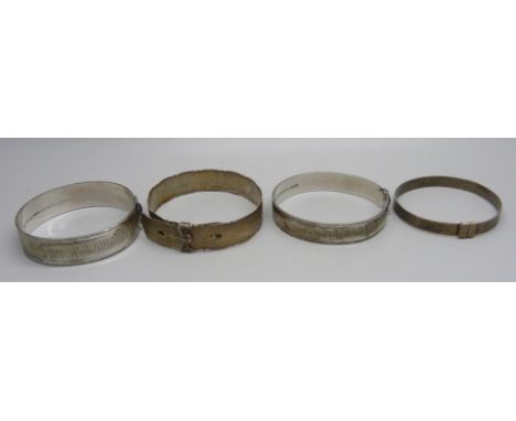 Four silver bangles including one buckle style with Edinburgh hallmark, 79g 